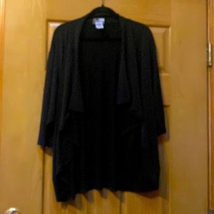 High/low black sweater with mid length sleeves.